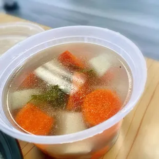 A soup that came with the rice plate. This one has small meatballs, carrots, potatoes, and some leafy greens.