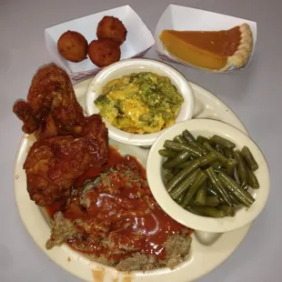 Chicken and pork combo dinner with broccoli, green beans, hush puppies and a slice of sweet potato pie