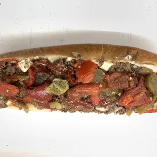 Cheesesteak with hot peppers, sweet peppers, mayo and ketchup.