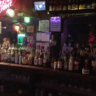 a bar with many bottles of alcohol
