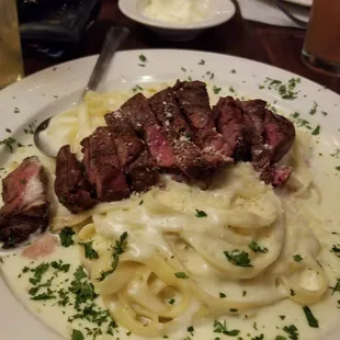 Fettuccini Alfredo topped with Filet Mignon
