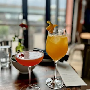 two cocktails on a table