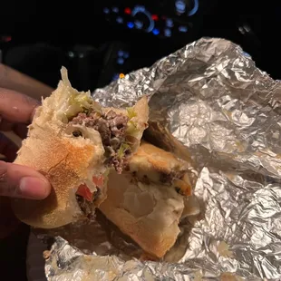 Philly cheesesteak with peppers, Whit American cheese,Tomatoes, lettuce, and Mayo