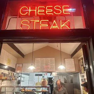 a man sitting at a counter in a restaurant