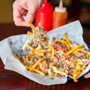 Cheesesteak Fries include: 
Fries Steak with or without Grilled Onions and cheez wiz.