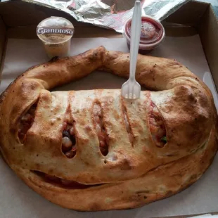 Calzone easily feeds two. The plastic fork is used to show scale.