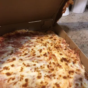 a cheese pizza in a box