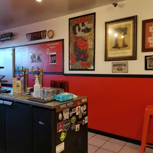 a restaurant with a counter and chairs
