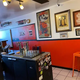 a bar with a counter and chairs