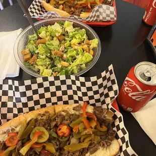 Philly cheesesteak with jalapeños and garlic fries