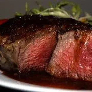 Try our Wednesday Steak night.  You get a 7 oz. filet with choice of two homemade sides and a glass of wine for only $19.95.