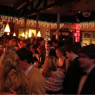 a crowd of people at a party