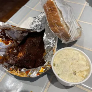 Rib lunch with potato salad.