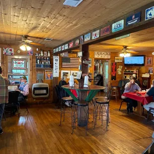 customers sitting at tables in a restaurant