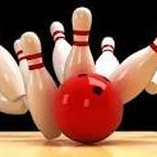 a bowling ball crashing into the pins