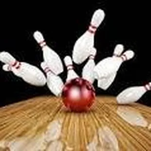 a bowling ball crashing into the pins
