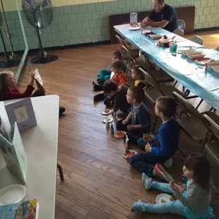 Patti reading a story while the kids enjoy a snack