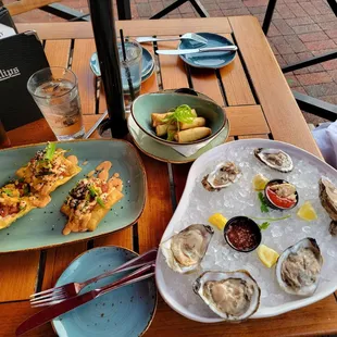 Tuna poke nachos, oysters, crab and shrimp spring rolls