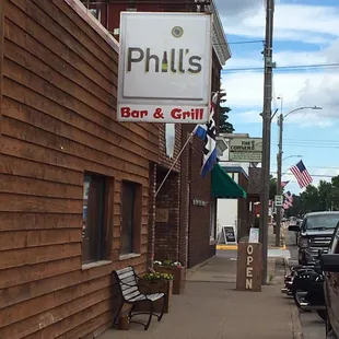 a bench on the sidewalk