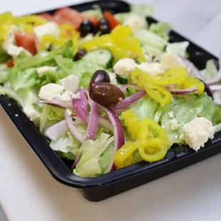 a salad in a plastic container