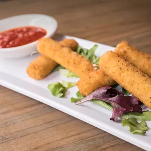 a plate of deep fried fish sticks