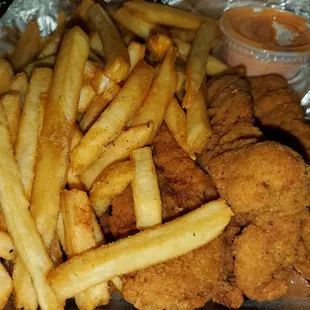 a plate of fried chicken and french fries