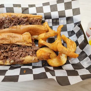 Traditional cheesesteak with banana peppers and hot relish on the side. (I ate about half the fries before this pic)