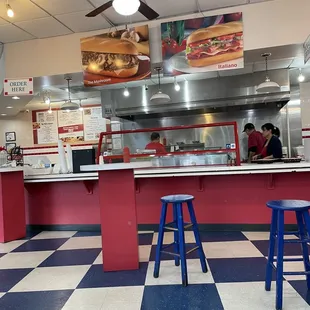 Order placing and pickup with grille behind