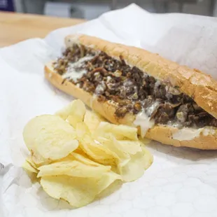 Cheesesteak with chips on the side. Delicious!