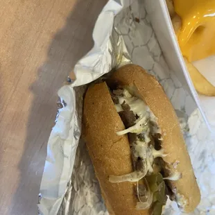 Look at all the cheese and steak  Delicious and juicy