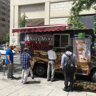 people ordering food from a food truck