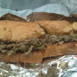 A delicious 8 inch Philly cheese steak sub.