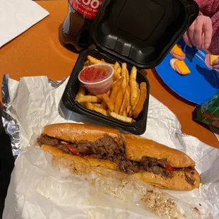 Ribeye chew steak with extra American cheese, sweet peppers, and ketchup! And their classic fries