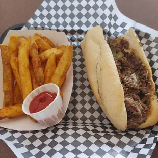 They Duke. Philly with pepper jack cheese and green chile. An order of fries. The fries are thick and nicely seasoned