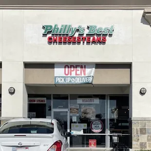 a car parked in front of a restaurant