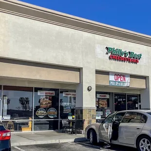 a car parked in front of a restaurant