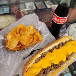 Nothing goes better with a cheddar cheesesteak and kettle chips than a refreshing bottle of Coke.