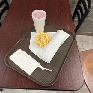 a tray of fries and a drink
