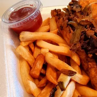 Philly cheesesteak with onions, bell peppers, mushrooms, and green onions. This picture was just half of the large size order