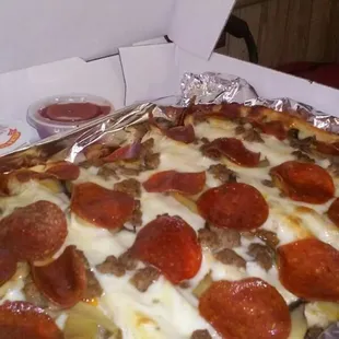 a pepperoni pizza in a box