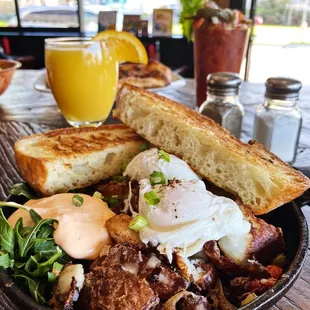 Pork Belly Hash with Poached egg, Griddle Toast, and Spicy Calabrian Sour Creme!