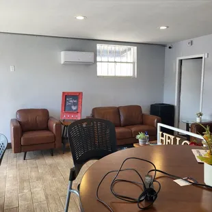 a living room with couches and a table