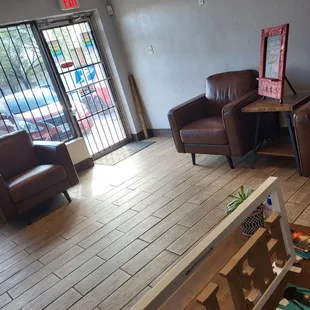a living room with a coffee table and chairs