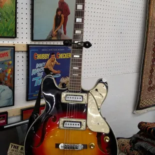 an electric guitar in the foreground