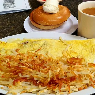 Bacon and cheese omelet, hash browns, bagel and cream cheese, $7.99