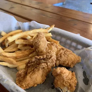 Kids basket with chicken tenders and fries.