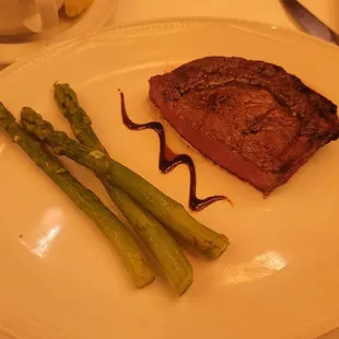 Phil's Italian Steakhouse - half of the 16oz ribeye (no bone) &amp; Asaparagus for $58.00. This was a shared plate