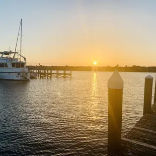 a boat docked at sunset