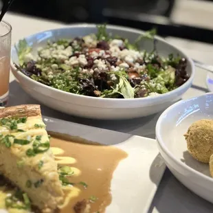 Boudin balls, savory crawfish  cheesecake, salad and tasty adult beverage.