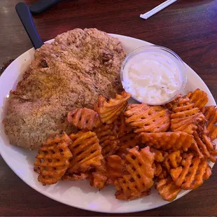 Chicken fried steak, sweet potato fries, creamy gravy.  Other side was a crisp, fresh salad with ranch dressing.